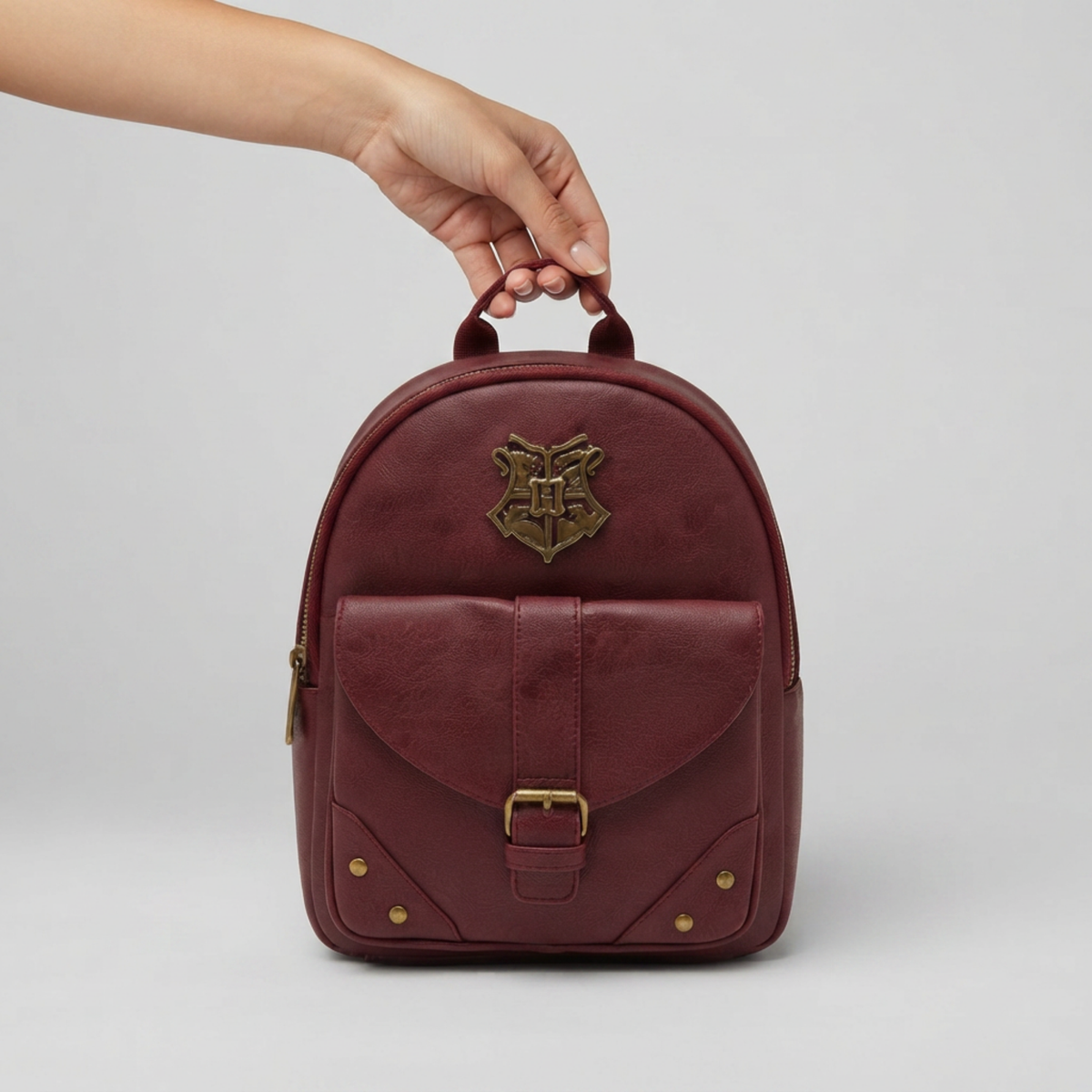 Mini Mochila Harry Potter Hogwarts Vino con Bolsillo Frontal Oficial
